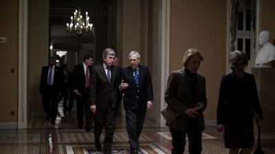 Senate Majority Leader Mitch McConnell, a Republican from Kentucky, centre right, speaks with Senator Roy Blunt, a Republican from Missouri. Bloomberg