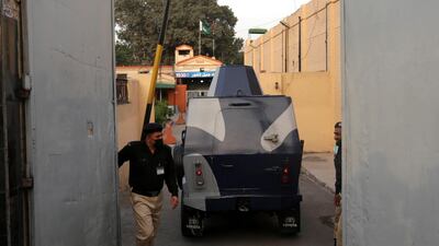 An armoured vehicle enters Lahore district jail during the trial of two men in the case on March 20, 2021. EPA