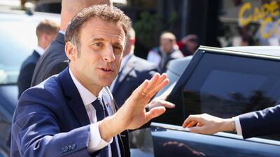 French President Emmanuel Macron waves to supporters as he goes back home after voting in the second round of the 2022 French presidential election, in Le Touquet. Reuters