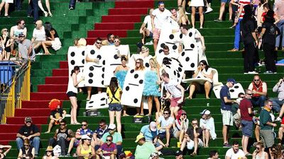 Fans dressed as dominoes during the Sevens World Series match between Spain and Australia at The Sevens in Dubai on Friday. Jake Badger for The National