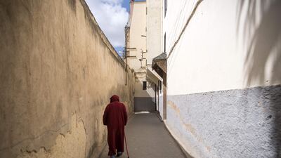 A man walks in the 9th century walled medina in the ancient Moroccan city of Fez on April 11, 2019. AFP