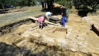 Local workers remove soil on the tomb of Ottoman Sultan Suleiman the Magnificent, near Szigetvar on September 2, 2016. The recent discovery of the tomb of Suleiman the Magnificent, considered the greatest Ottoman ruler, has raised hopes of a tourism boom in one of Hungary's most impoverished areas. Attila Kisbenedek/AFP