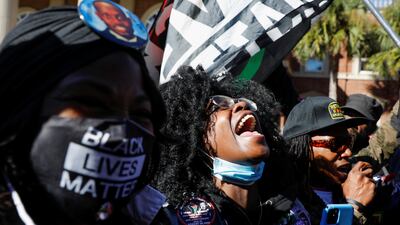 People react outside the Glynn County Courthouse after the jury reached a guilty verdict in the trial of William Bryan, Travis McMichael and Gregory McMichael, charged with the February 2020 death of 25-year-old Ahmaud Arbery, in Brunswick, Georgia. Reuters