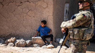 An American soldier on patrol in the countryside Qamishli, in easterb Syria, on June 12, 2022. AFP