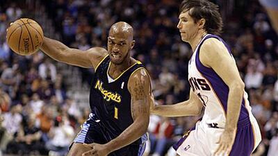 Denver's Chauncey Billups drives past Steve Nash.