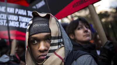 Protesters march through the streets demanding a raise on the minimum wage to $15 per hour on December 4, 2014 in New York, United States. The movement, driven largely by fast food workers, has risen in prominence in the past year; the protests were also joined by demonstrators angry at the Grand jury verdict to not indict the police officer who killed Eric Garner in July, 2014. Andrew Burton / Getty Images / AFP
