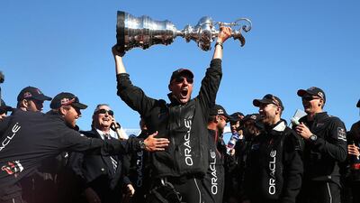 Oracle Team USA, with captain by James Spithill, celebrates onstage after defending the America's Cup as they rallied to win eight straight and beat Emirates Team New Zealand at San Francisco bay. Justin Sullivan / AFP