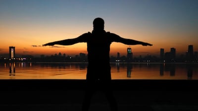 A man exercises in the early morning along the Arabian Sea in Mumbai, India.