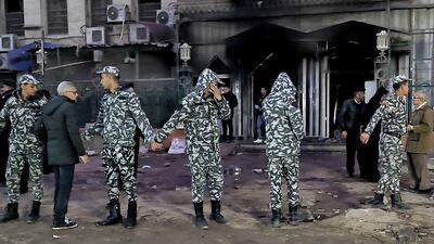 Egyptian security forces form a cordon outside Al Nour Al Mohammady hospital in Cairo after a fire broke out on February 1, 2023. AFP