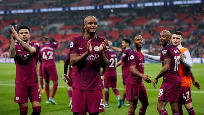 Manchester City captain Vincent Kompany leads the applause after the 3-1 Premier League win over Tottenham Hotspur on Saturday. David Klein / Reuters