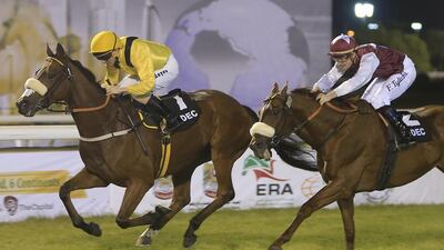 Christopher Hayes rides Forjatt, left, to victory in the National Day Cup Prep race at the Abu Dhabi Equestrian Club. Ravindranath K / The National