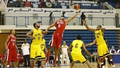 Al Ahli, in red, win ugly to beat Al Wasl for President's Cup basketball title. Mike Young / The National