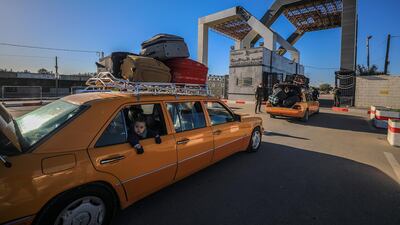 Palestinians wait to cross into Egypt through the Rafah border. EPA