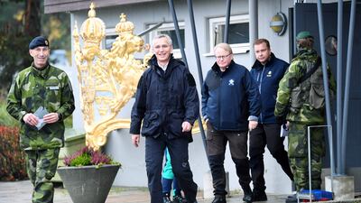 Nato Secretary-General Jens Stoltenberg, centre, inspects military exercises in Sweden in October. AFP