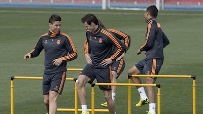 Real Madrid’s Portuguese forward Cristiano Ronaldo, left, and Real Madrid’s Welsh forward Gareth Bale, centre, practice during a training session the day before Real Madrid play Bayern Munich in a Uefa Champions League semi-final, first leg match in Madrid on Wednesday. AFP PHOTO / DANI POZO