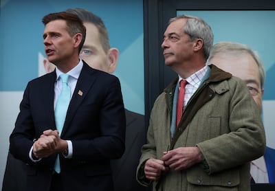 Reform UK leader Nigel Farage, right, and by-election candidate Matt Goodwin campaigning in Manchester. EPA