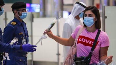 Passengers from Beirut are presented with flowers on arrival at Dubai International Airport last night. Courtesy: Dubai Customs