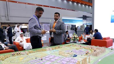 Visitors at the model of Dubai Silicon Oasis. Chris Whiteoak / The National