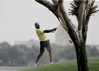 Dwight Yorke playing golf at the Dubai Creek Club.