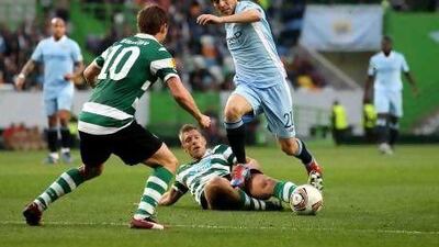 David Silva of Manchester City is tackled by Sporting Lisbon's Stijn Schaars last night. Scott Heavey / Getty Images