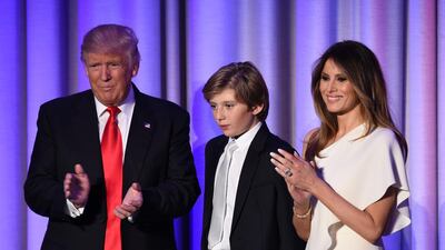 US President-elect Donald Trump arrives with his son Baron and wife Melania at the New York Hilton Midtown in New York. Trump stunned America and the world Wednesday, riding a wave of populist resentment to defeat Hillary Clinton in the race to become the 45th president of the United States. Saul Loeb / AFP