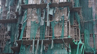 Protective scaffolding cloth is seen ripped on a building under construction after heavy winds in Macau. The death toll from Severe Typhoon Hato rose to at least 16 after the storm left a trail of destruction across southern China, blacking out Macau's mega-casinos and battering Hong Kong's skyscrapers. Anthony Wallace / AFP