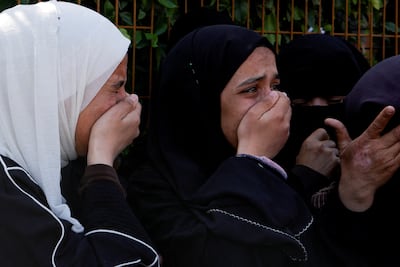 Palestinian women in Khan Younis, southern Gaza, mourn medics killed when they came under Israeli fire while on a rescue mission. Reuters