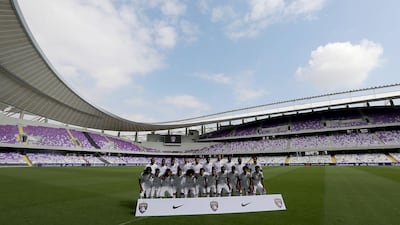 Al Ain FC team pose at the new Hazza Bin Zayed Stadium which accommodates 25,000 spectators in Al Ain. Satish Kumar / The National