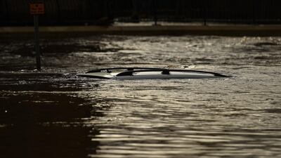 The roof of a submerged car is pictured in a flooded street in Mytholmroyd, northern England, after the River Calder burst its banks as Storm Ciara swept over the country. AFP