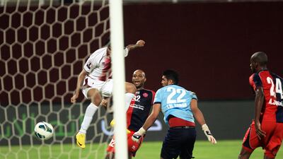 Salem Salah heads home as Al Wahda put six past Al Shaab during their Etisalat Cup encounter. Ravindranath K / The National