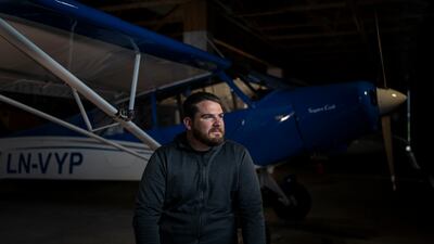 Aviator and adventurer Garrett Fisher poses for a portrait in Voss, Norway, on Aug. 2, 2022. Fisher is on a mission to photograph all the remaining glaciers that are not in the polar regions before they disappear. (AP Photo / Bram Janssen)