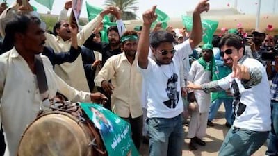 Supporters of Pakistan's former military ruler Pervez Musharraf celebrate his homecoming outside the airport in Karachi.