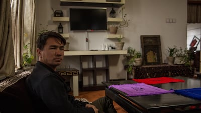 Abdullah Mahmoodi, owner of the Highland Hotel in Bamyan, sits in the guest house's living room. All international tours have been cancelled.