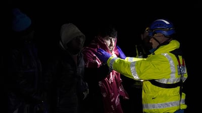 A migrant being helped in Dungeness. PA