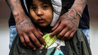 Brooklyn Centre resident Jose Chavez wraps his arms around his daughter Cattleya Chavez, 3, during a protest outside the Brooklyn Centre Police Department, in the US, days after Daunte Wright was shot and killed by a police officer. Reuters