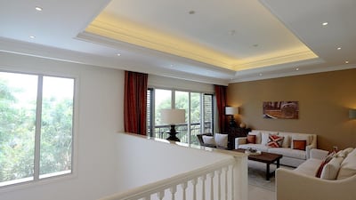 A livingroom area on the first floor in a four-bedroom Mediterranean villa. Buyers purchase the plot first, then choose what style of villa they want. Satish Kumar / The National