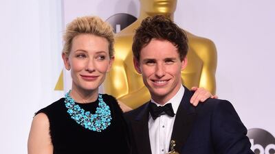 Best actor winner Eddie Redmayne with presenter Cate Blanchett backstage at the 2015 Academy Awards. (Frederic J Brown / AFP)
