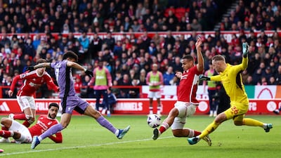 Liverpool's Luis Diaz battles with Nottingham Forest's Murillo and Matz Sels. Action Images