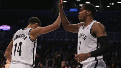 Joe Johnson, right, led the Nets with 27 points on Wednesday. Peter Foley / EPA