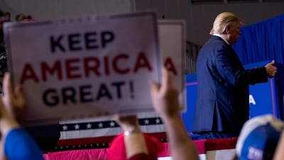 President Donald Trump finishes as speech at a rally at BancorpSouth Arena in Tupelo, Miss., AP
