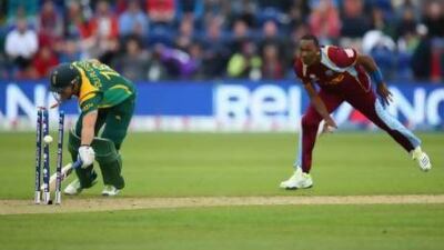 Dwayne Bravo runs out Faf Du Plessis in Cardiff. Michael Steele / Getty Images