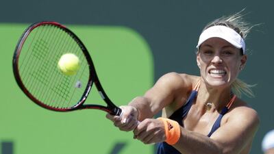 Angelique Kerber of Germany hits a return to Shelby Rogers during the Miami Open tennis tournament, Sunday, March 26, 2017, in Key Biscayne, Florida. Lynne Sladk / AP Photo