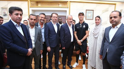 Portuguese forward Cristiano Ronaldo (third, right) posing for a picture with officials from Persepolis FC. EPA