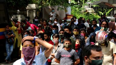 Fans gather near the residence of Indian actor Dilip Kumar after he died in a hospital in Mumbai on July 7, 2021.