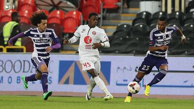 Al Jazira’s Ahmed Al Ghilani, centre, will meet some familiar foes in Al Ain’s Omar Abdulrahman, left, and Mohamed Ahmad in the Asian Champions League knockout stage next month. Al Ittihad