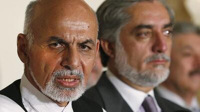 Afghan presidential candidate Ashraf Ghani, left, and rival Abdullah Abdullah at a news conference in Kabul on Saturday. Jim Bourg / Reuters