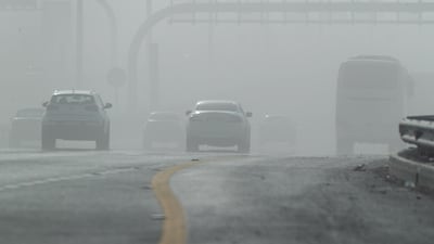 The sandstorm has reduced visibility on the E12 highway in Abu Dhabi. Victor Besa / The National