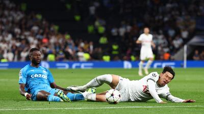 Marseille's Chancel Mbemba fouls Tottenham's Son Heung-min before being shown a red card. Reuters