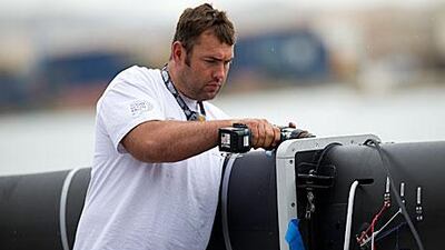 Wade Morgan, the Abu Dhabi Ocean Racing bowman, prepares a new mast in Alicante yesterday.