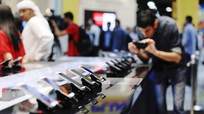 The average UAE resident spends Dh3,000 on consumer electronics per year, with smartphones making up the majority of purchases. Sarah Dea / The National